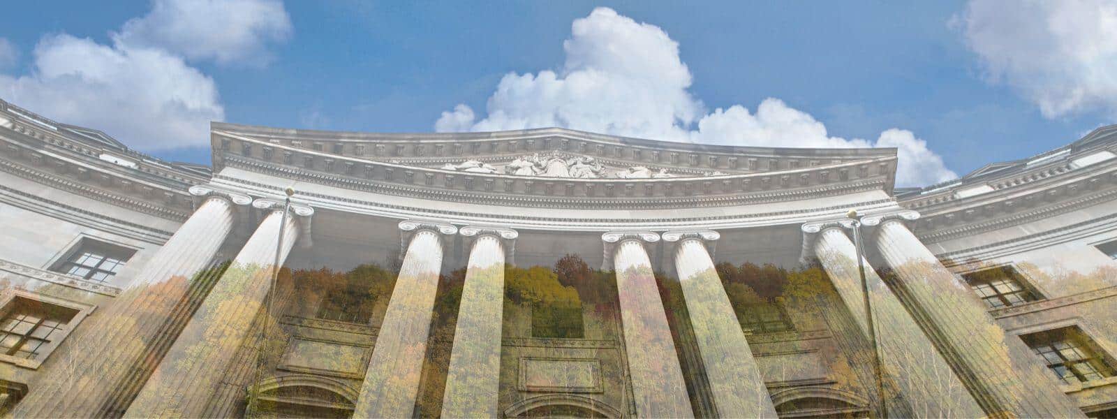 Photo of government building overlaid in low opacity over a forest